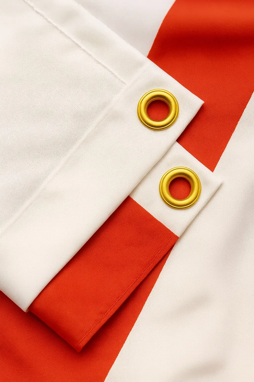 Close-up of an England flag's red St George's Cross on white fabric